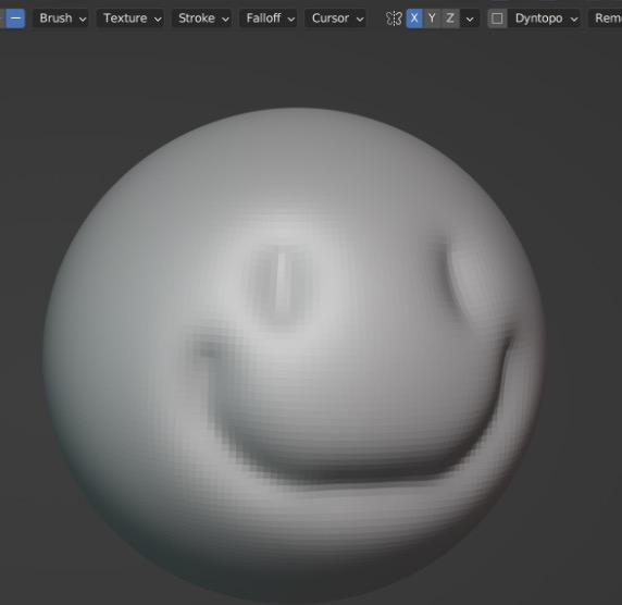 Ein grob in die Sphere geschnitztes Smiley-Gesicht